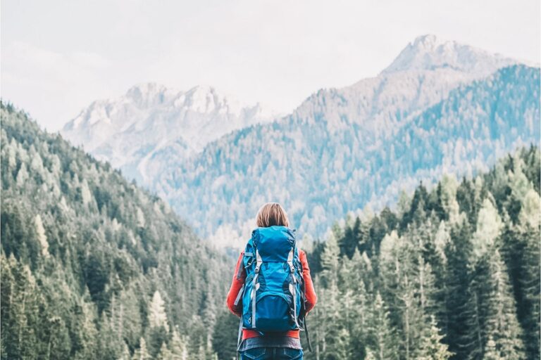 backpacker looking over at the mountains