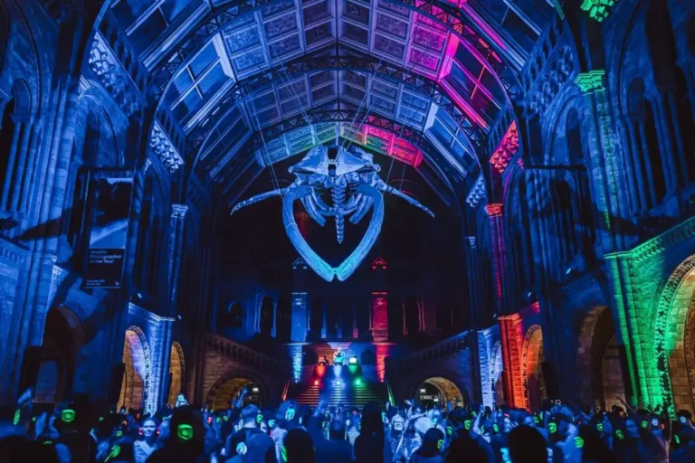 Silent Disco Natural History Museum Interior with an animal skeleton above the entrance of the museum.