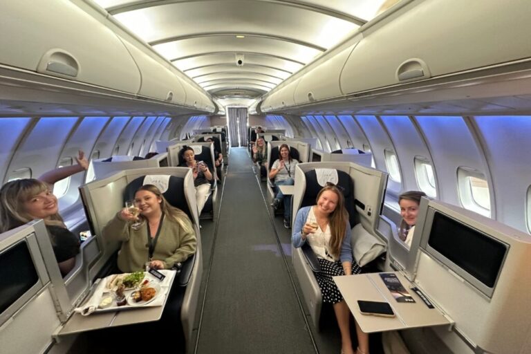a few people sitting in business class on the 744 experience living the upper class life